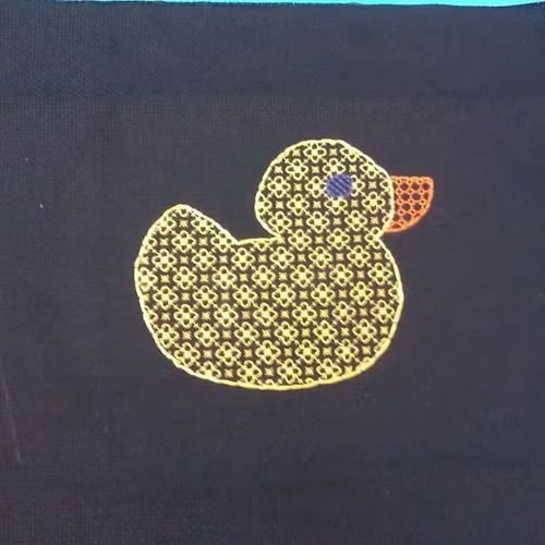 A blackwork embroidered rubber duck.