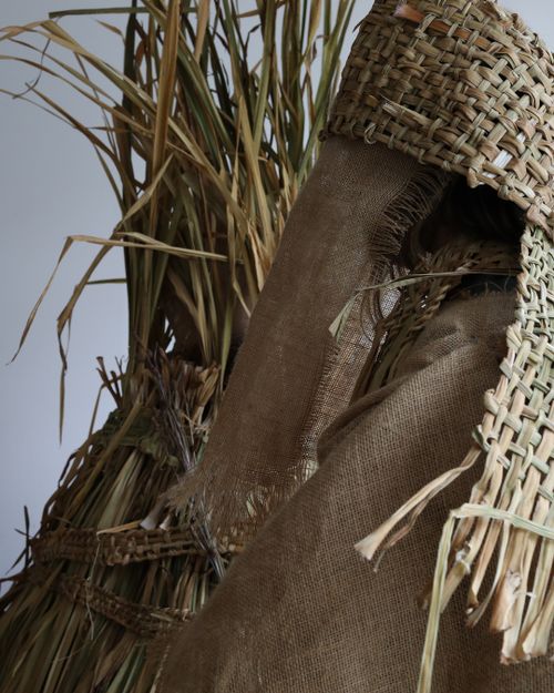 The photograph shows a close up of two body disguises. The disguises are made from Flag Iris / Feileastram.